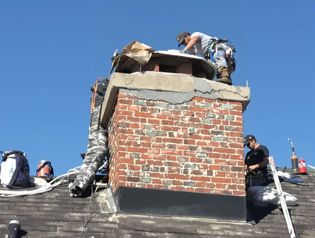 Brooklyn Chimney Sweep installing a custom chimney crown in Brooklyn, OH