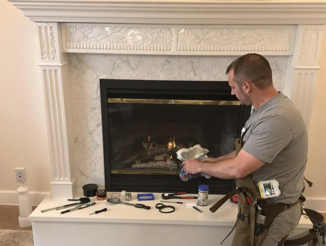 Brooklyn Chimney Sweep performing fireplace maintenance in Brooklyn, OH