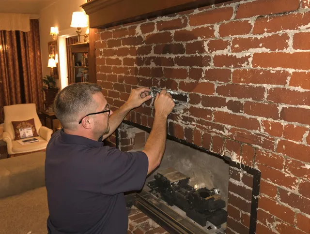 Brooklyn Chimney Sweep expert fixing a fireplace in Brooklyn, OH